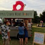 Mini donut stand in grassy area