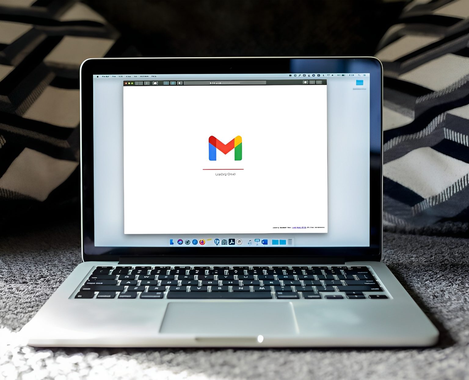 Open laptop with Gmail logo visible